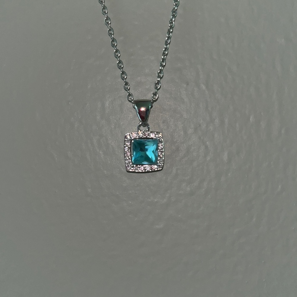 Blue topaz and diamond necklace
